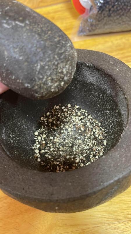 Crushed black pepper in mortar